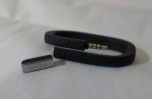 Jawbone Up with its cap removed to show the plug