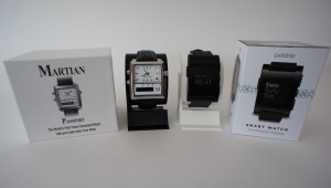 Martian and Pebble smartwatches side-by-side with their original boxes