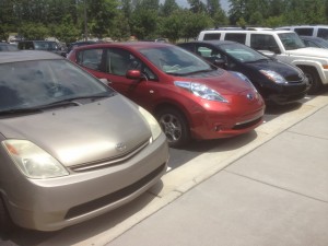 My LEAF smuggly parked between two Prii